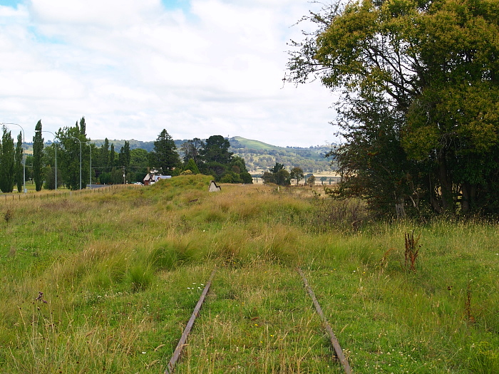 The view looking south. Beyond the goods ramp were the goods shed and station, both on the left side of the track.