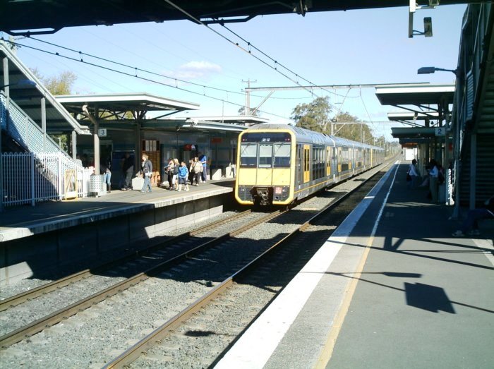 A Tangara leaving platform 3 heading to Macquarie Fields, on the Down main.