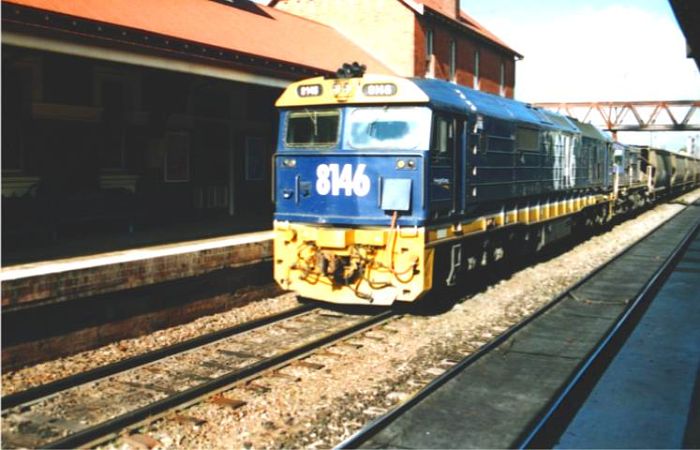 
8146 heads a train heading south through the station.
