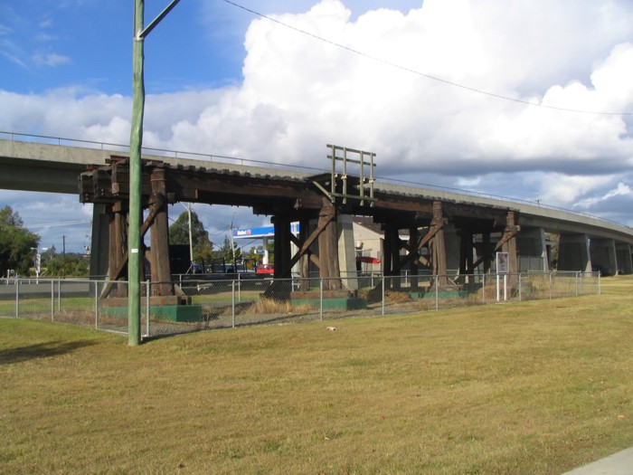 Three timber spans of the original South Grafton viaduct lie adjacent to the line not far to the south of Grafton City station.