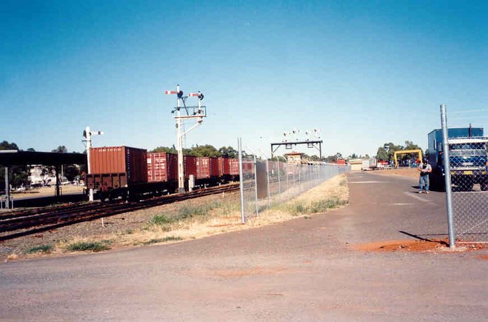 The view looking down the line. The signal box can be seen under the signal gantry in the middle distance.