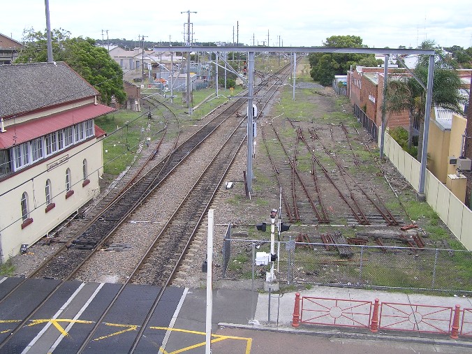 
An elevated view looking west.  The Mill Siding is in the left foreground,
with Hamilton Junction visible in the distance.  The tracks on the right
are the remains of the sidings which were at the start of the short Wickham
branch.
