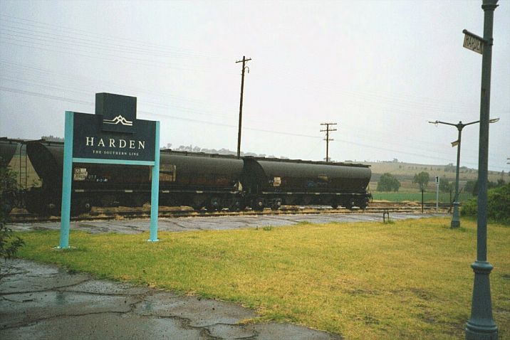 
Old and new signage adorning the platform.  Some wheat hoppers site in
the yard in the background.
