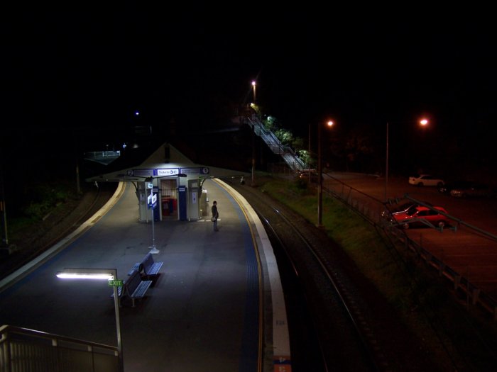 A night view looking down to the platform from the footbridge.