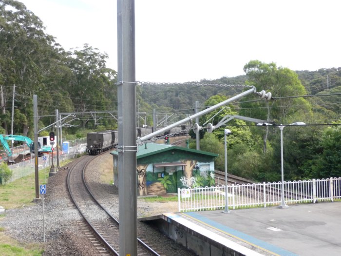 The view looking up the line from the station as a coal train heads north.