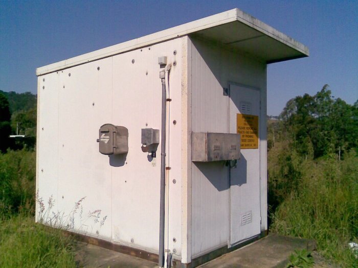 The level crossing protection hut near the down end of the station.