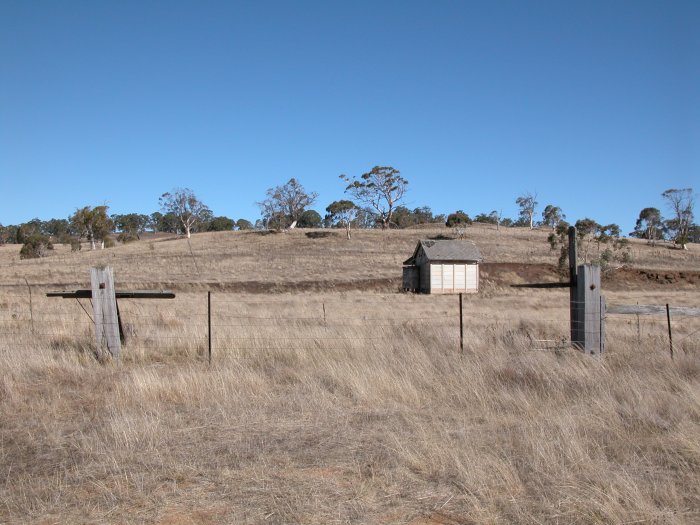 The road-side approach to the station. Note the remains of the gates at the entrance to the station.