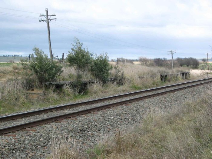 The remains of an old wooden-faced platform.