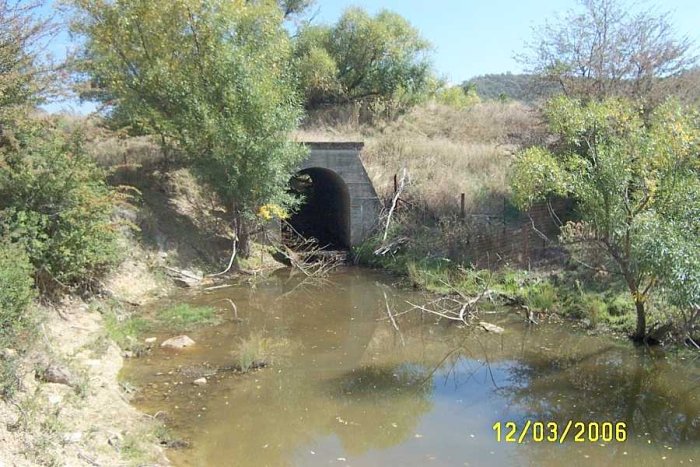 The Irondale line crosses a small creek. At the top of the concrete arch is the dirt track, above this the next level up is the Irondale line.