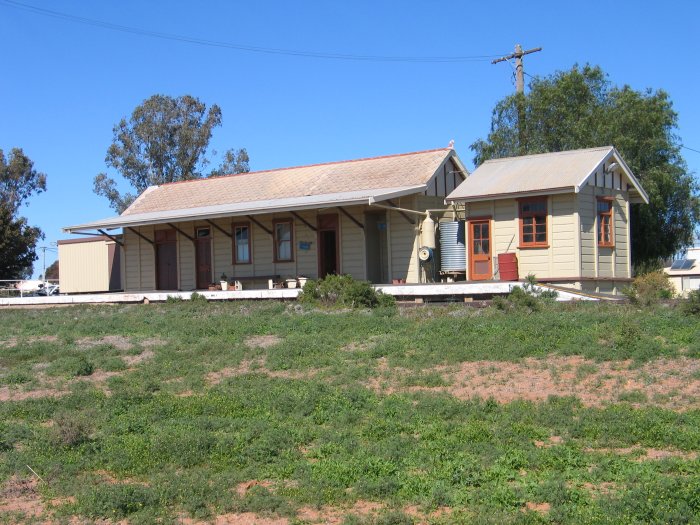 A view of the well-preserved station and signal box buildings.