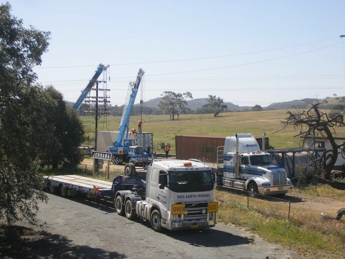 A busy day at Jerrawa after a derailment near Oolong. Transferring containers from the damaged flatcars to flatcars to be picked up by the next Perthbound freight.