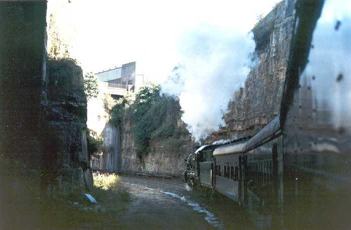 
A tour train is in the deep cutting at the eastern end of the John
Street Tunnel.
