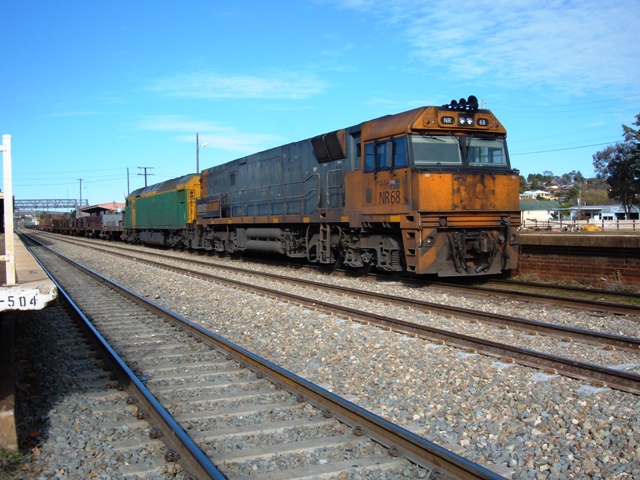 A dirty NR68 and AN head train XW4 through the station.