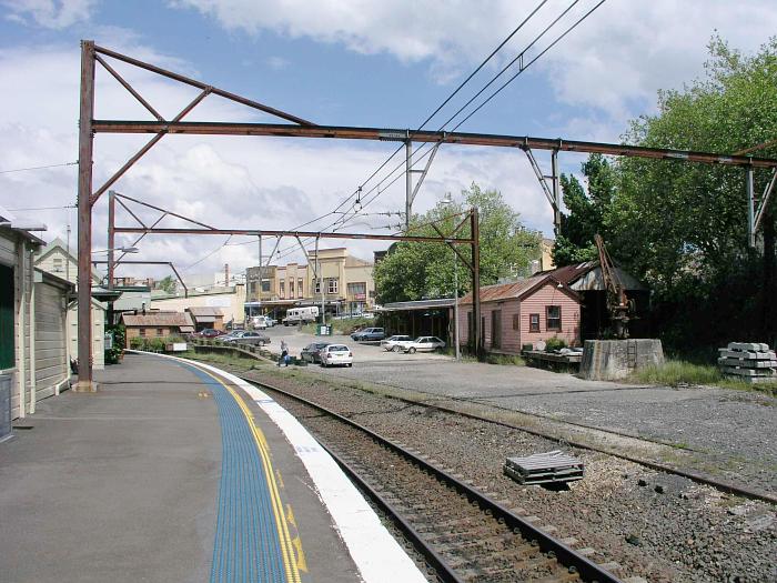 
The view looking south-east over the old yard.  The track
in the foreground is the No 1 Goods Siding, while the No 2 Goods Siding
runs behind the jib crane and goods shed.
