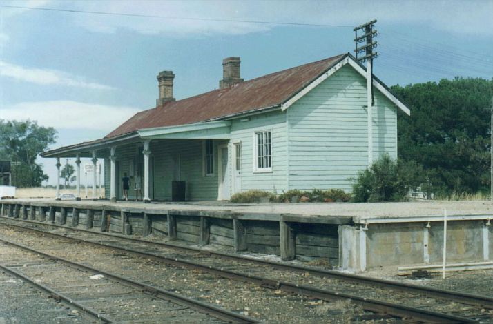 
Koorawatha station is still being tended in this 1991 shot.  This is the
view from the northern end.  The branch line to Grenfell runs behind
the station before turning off to the west.

