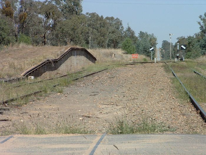 
The view looking south, showing the goods platform, semaphore and
train orders signals, and the steam-era water column.
