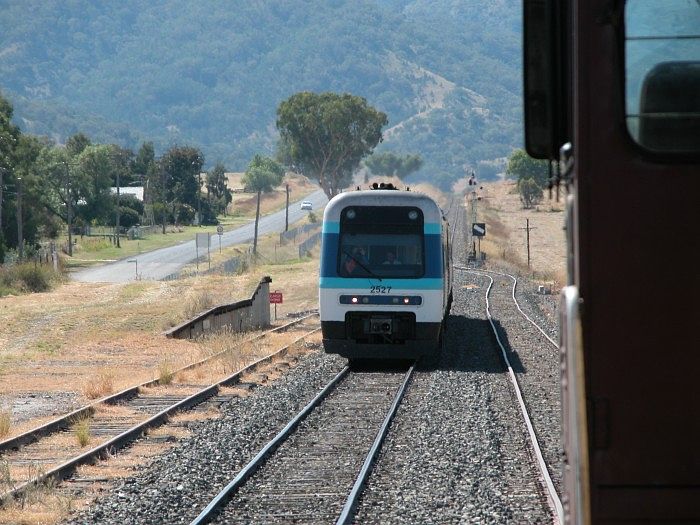 
A Sydney bound Explorer approaches Kootingal station. The old goods loading
platform is on the left.
