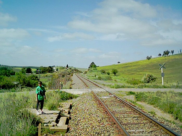 The remains of the signal box, and road crossing at down end of platform.