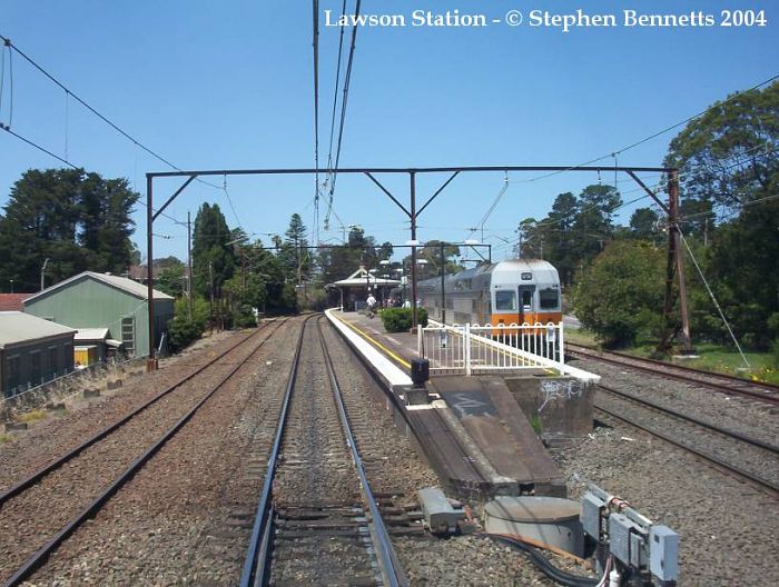 
The view approaching the western end of the station from the front of an
Up service from Lithgow. A down service V-Set is alongside platform 2.
