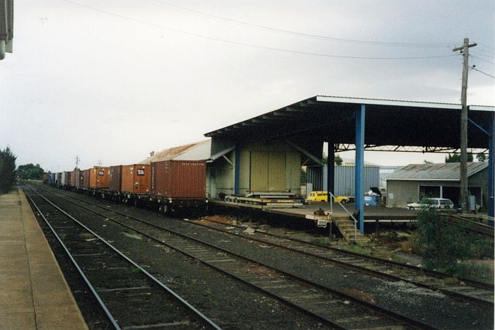 
The goods shed with a few container wagons in the siding.
