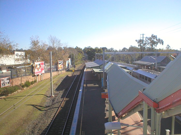 The view looking north along platform 3. The grass area to the left is the location of the former goods loop siding.