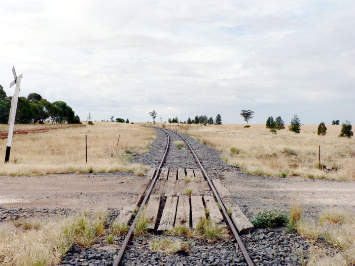 The view looking down the line towards Oaklands. The former station was on the left of the line, with loop siding on the right.