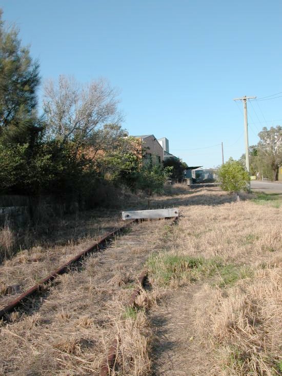 After the Dairy Farmers factory closed a buffer was placed on the line before the track reached the Dairy Farmers Factory. 
