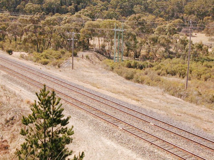 The former junction of the Commonwealth Siding, which left the Up Main in a trailing junction, before curving around to the right and leading to the Marrangaroo Army Base.