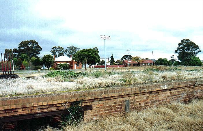 
The overgrown platform still sports a name board.  The portal at the
bottom left was where the signal wires and rods extended out to the
points and semaphore signals in the yard.
