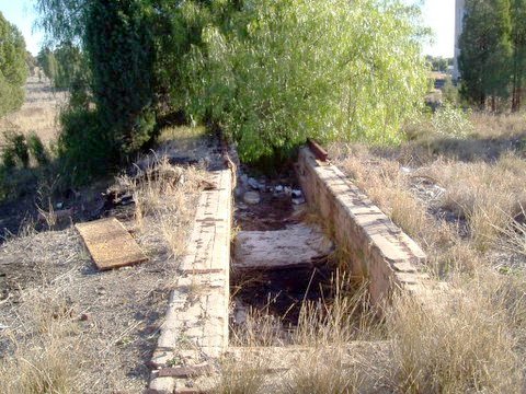 The remains of a locomotive ash pit.