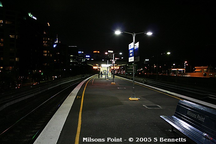A shot of Milsons Point station after dark. Taken from the Harbour Bridge end of the platforms looking northwards.