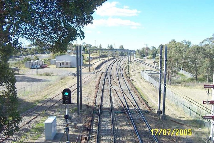 The view looking north from the station.  The goods platform can be seen in the distance next to the line.  The siding on the right are the former stock siding and up refuge loop.