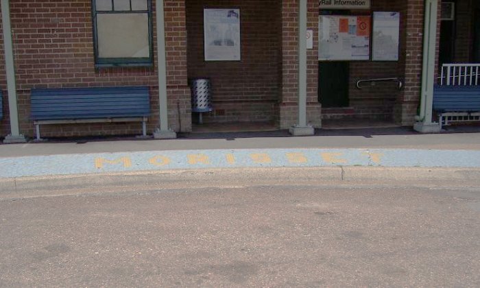 The roadside view, showing the mosaic of the station name.