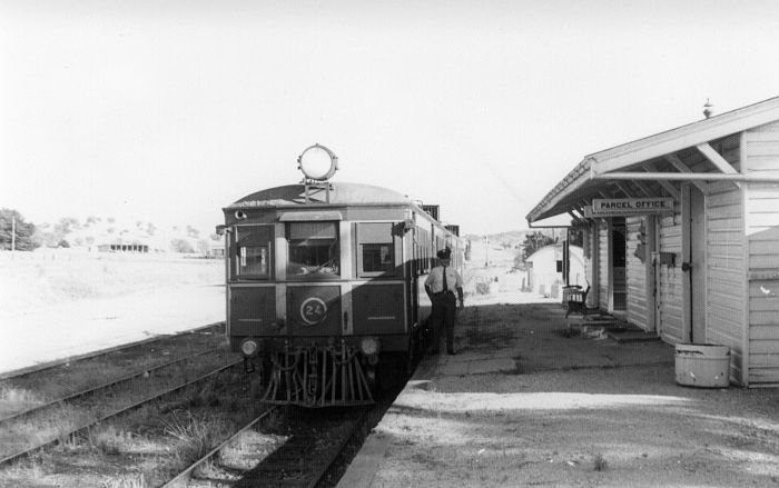 
Ashley Hay, the guard for this run, poses beside CPH 24 while it waits at
Mount Horeb station.
