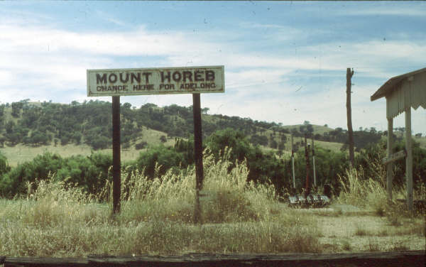 A weathered sign board on the platform.