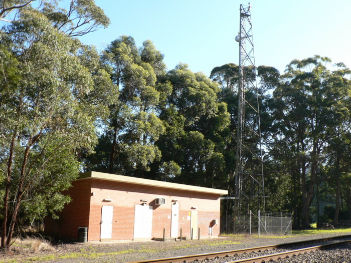 The modern brick traffic hut opposite the station.