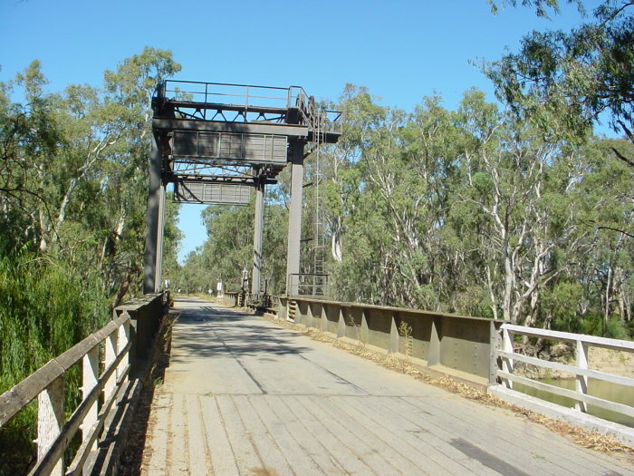 
The rails from the former line are still visible in the road surface on the
bridge.
