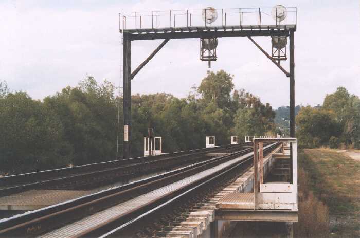 
The view of the northern approaches to the Union Bridge looking north towards
Albury.  The Victorian broad gauge track is on the left and the standard gauge
is on the right.
