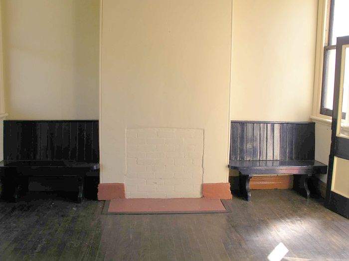 
The walled-up fireplace in the waiting room.
