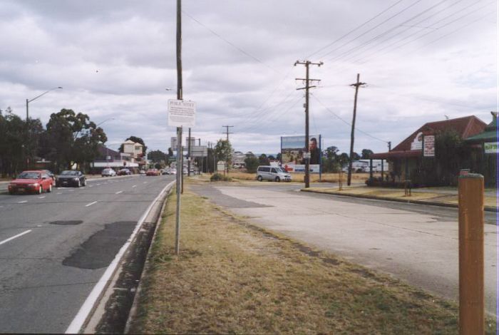 
The view looking towards the location of Narellan.  The line crossed the
road from the left in the middle distance before continuing down the
right hand side of the road.
