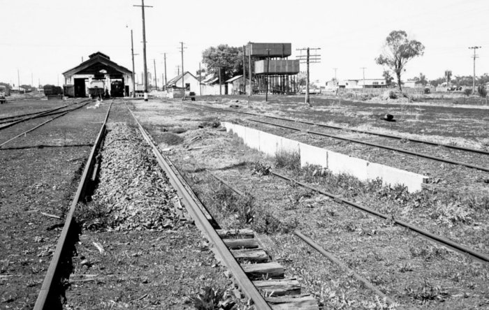 A filled-in ash pit, with the lowered track on the right being all that remains of the former coal stage.