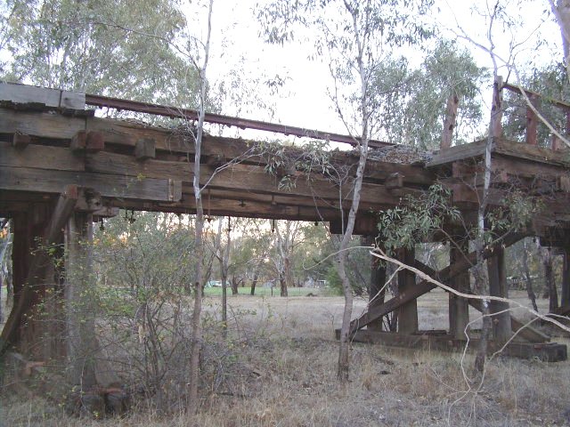 The trestle is in poor condition in places where the decking and sleepers have rotted leaving the rail line suspended in mid air - a view taken on the northern bank of the Murrumbidgee River.