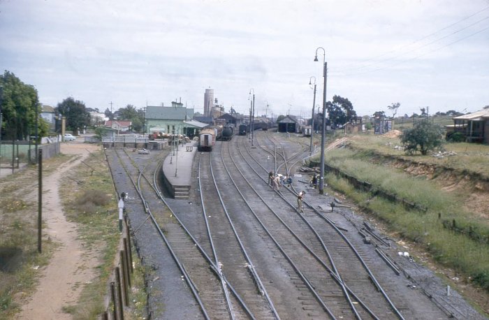 The view looking down the line towards the station.  On the left is the dock siding, with the main, loop and back roads opposite the platform. The sidings on the far right leads to the Rail Motor shed (dark building) and the loco facilities.  In the distance is the Wise Brothers Mill.