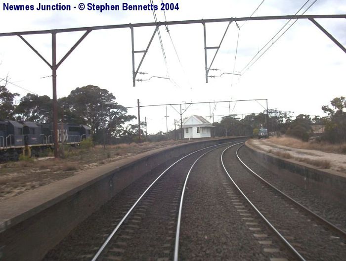 
The view looking towards Sydney.
The signal box was cut in and a coal train from the nearby Clarence Colliery
can be seen on the left waiting for its path to Port Kembla.
