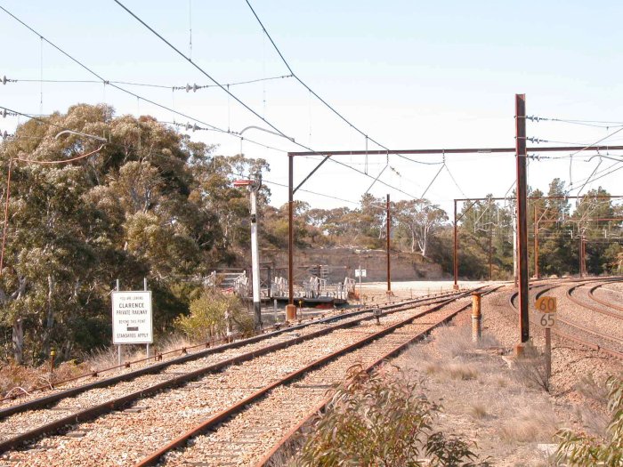 The view from the up end of the station.  The sign reminds coal train drivers that they are entering RIC controlled territory.  The structures in the distance are the remains of the overhead footbridge.