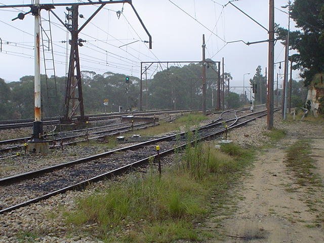 The view looking west of the coal loop arrival/departure road. Beyond that is the now-truncated refuge loop with stop block. At the rear are the main lines.
