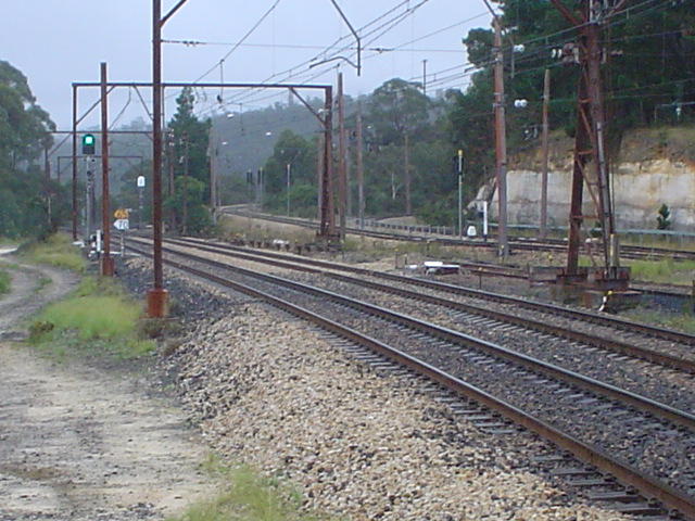 The view looking west showing the main lines and the Clarence Coal Loader departure (left) and arrival (right) roads. Note that the overhead has been removed from the balloon loop.
