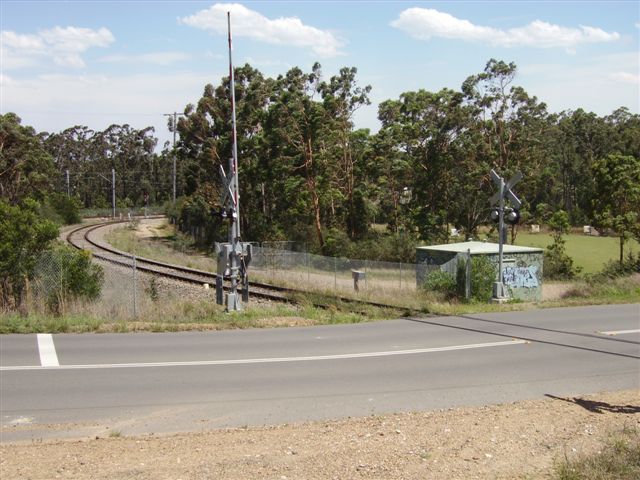 The southern leg of the triangle that connects Newstan Colliery (behind camera) to the main line immediately north of Fassifern Station, which is obscured by the trees behind the boom gate.