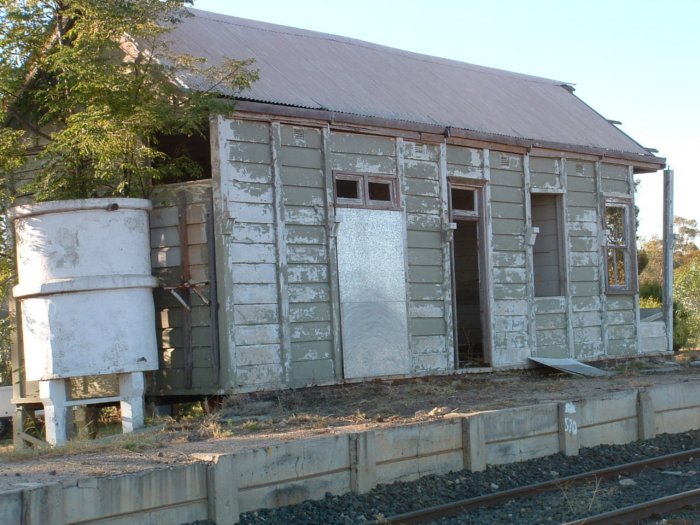 A closer view of the rail-side of the concrete station building.