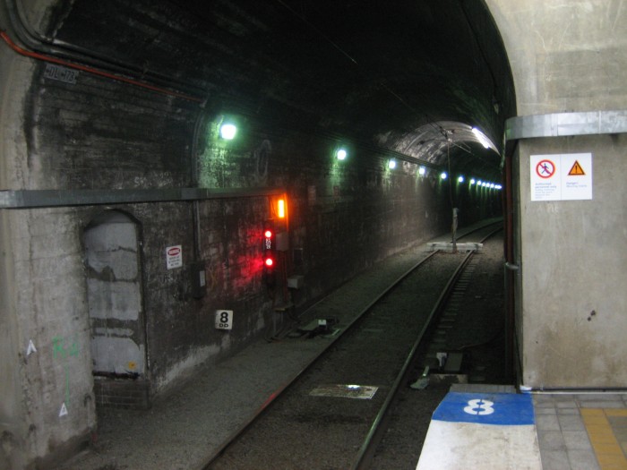 North Sydney Tunnel No 2 from the northern end of platform 2. Note the temporary buffer stop installed while excavation works on platforms 1 and 2 are being carried out. The track and tunnel beyond the buffer to the car siding junction is still being used to store off peak train sets.